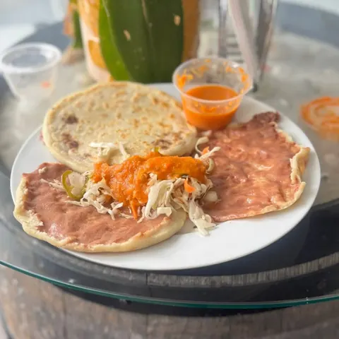 Pupusas with curtido and salsa roja